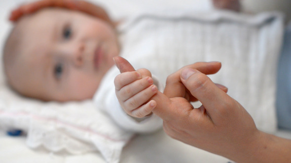 Baby Holding Mother's Finger