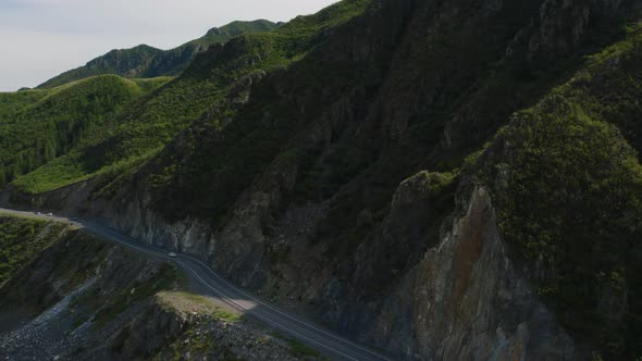 Mountains valley of Altai with traffic cars on Chuya highway