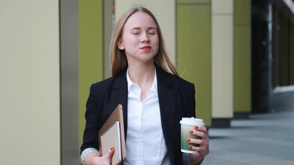 Confident Young Woman in Suite and White Shirt Walking in City Near Office