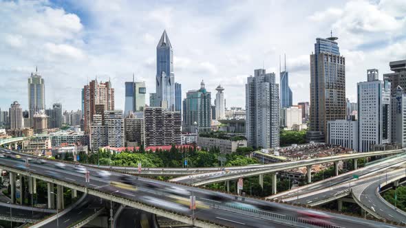 Timelapse of busy traffic road with modern office building in Shanghai china alt