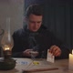 Black Magician Practicing Tarot Cards Reading - VideoHive Item for Sale