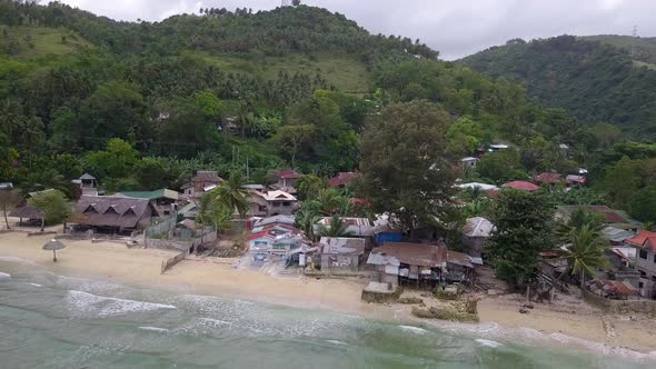 Beautiful panoramic aerial drone view of the rural town Matutinao in Cebu in the Philippines with th alt