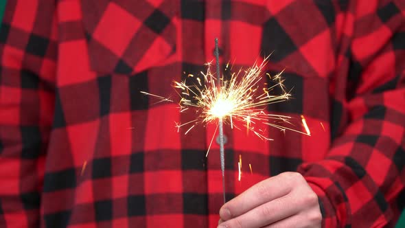 Teen Holding Sparkler and Celebrating New Year