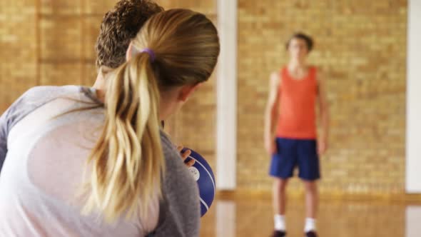 Determined high school kids playing basketball alt