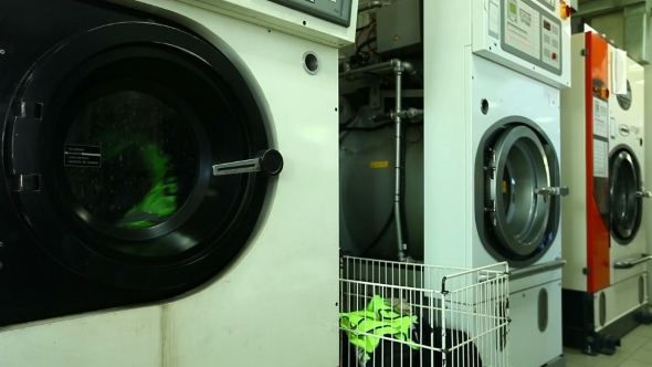 View Of Working Washing Machine In Laundry