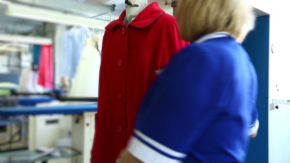 View Of Laundry Worker Treated With Steam Coat