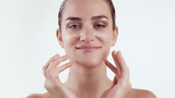 Skin Care Cream To Face. Woman with Perfect Skin