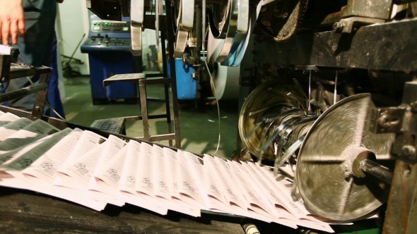 Newspaper On Production Line In a Print Shop