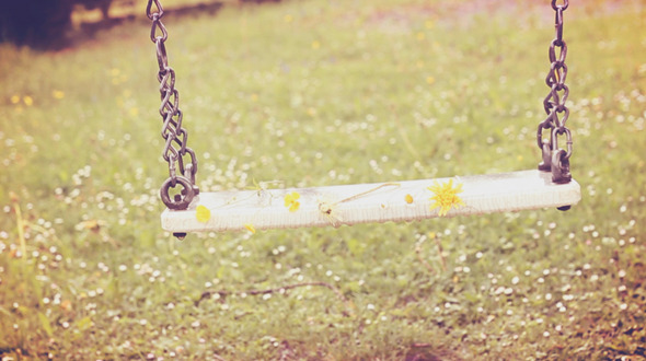 Empty Swing  Moving With Flowers