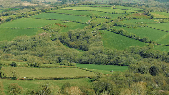 Car Passes Through Countryside Landscape alt
