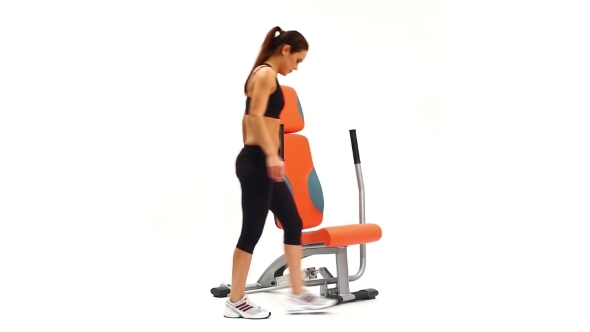 Brunette Woman On Hydraulic Exerciser