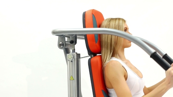 Blonde Woman On Hydraulic Exerciser