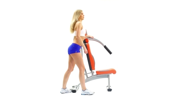 Athletic Young Woman On Hydraulic Exerciser