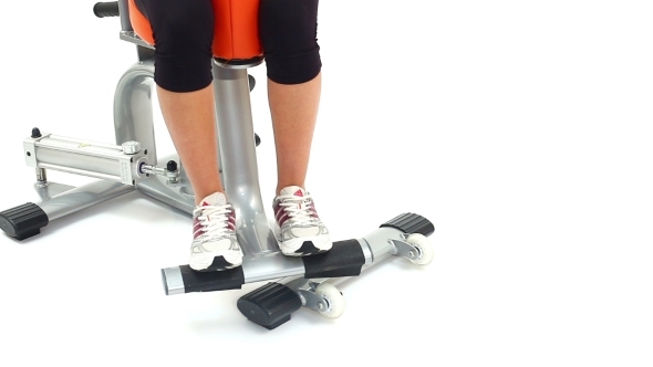 Fragment Of Young Woman On Hydraulic Exerciser alt