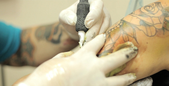 Tattoo Artist Working On