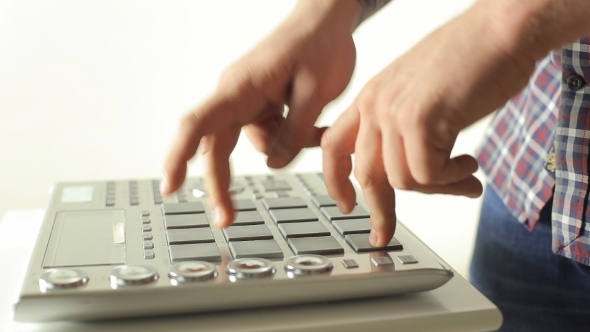 Talented Guy Playing On Pad Midi Controller In