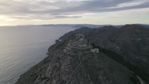High aerial view Battery Castillitos, military fortification on Hilltop by mediterranean sea. Cartag