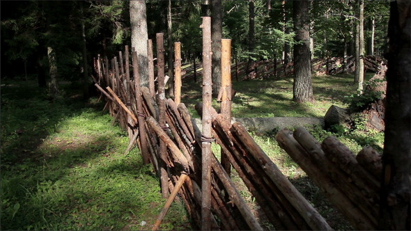 Wooden Fence of the Log House Protecting  