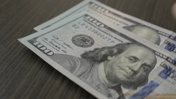 Counting USD currency  wad slow-mo 1080p FullHD footage - Slow motion American dollar banknotes fall alt