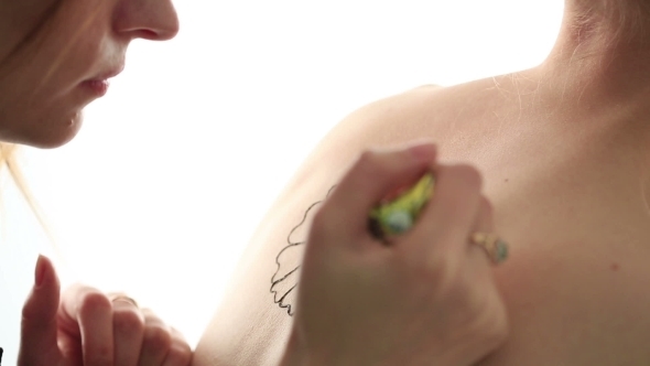 Master Doing Tattoo On Back Of Naked Girl