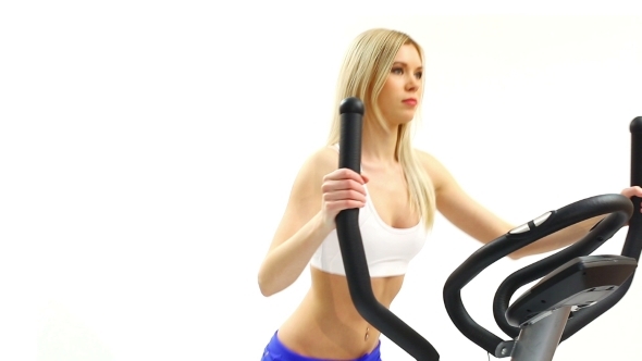 Slim Blonde Woman On Exerciser