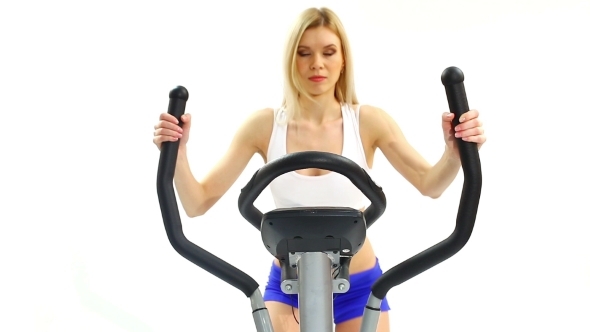 Young Blonde Woman On Exerciser
