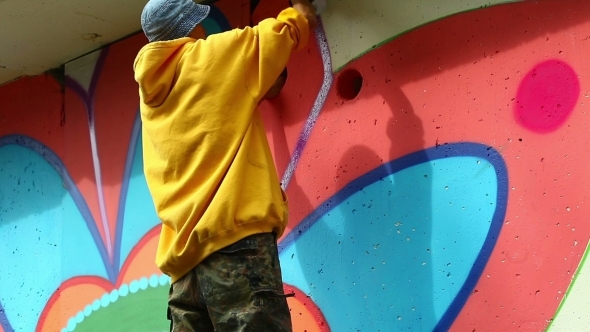 View Of Young Graffiti Artist At Work