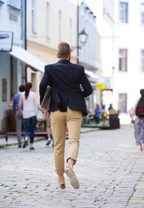 Hipster businessman hurrying