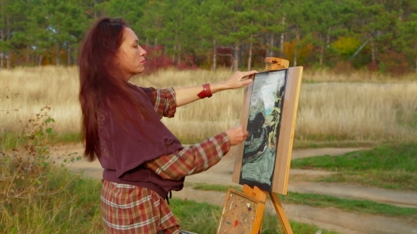 Middle Aged Woman Drawing A Picture Plein Air