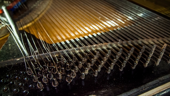 Dismantling Process Of Old Piano Strings 