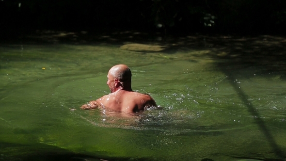 Man Swimming In River