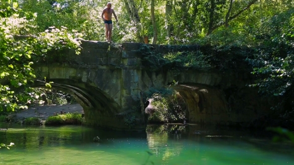 Man Jumping Into The River 