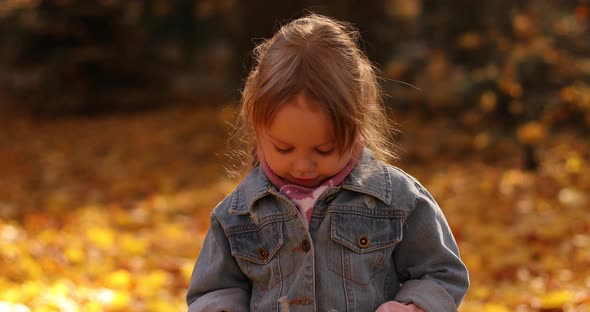 Pretty Little Girl in Black Mum's Sunglasses Smiles and Rejoices