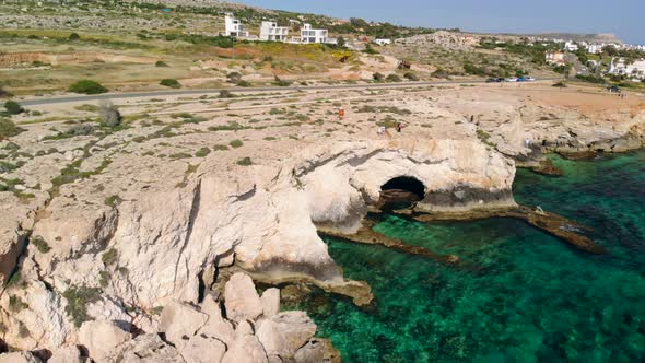 Aerial View of Sea Caves in Rocky Seashore, Ayia Napa, Cyprus alt