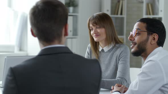 Multiethnic Colleagues Having Business Discussion at Office Meeting alt