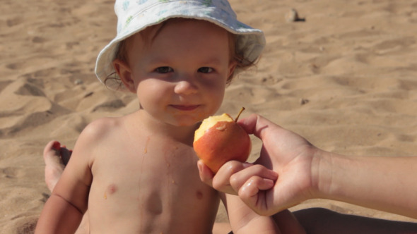 Feeding Son With Apple