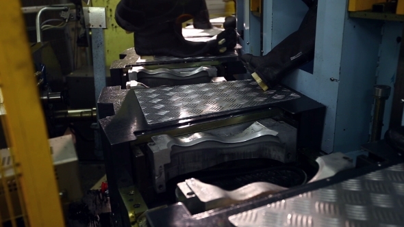 View Of Machine Heats Rubber Sole For Boots