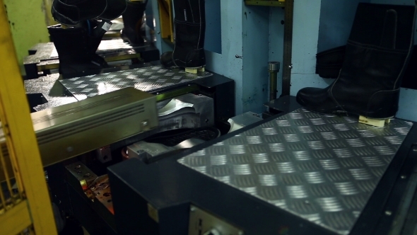 View Of Unfinished Boots On Production Machine