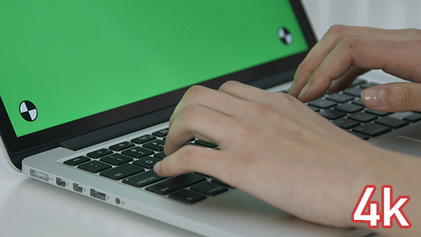 Girl Typing on Green Screen Laptop
