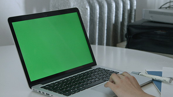 Girl Using Trackpad on Green Screen Laptop
