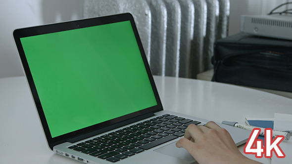 Girl Using Trackpad on Green Screen Laptop