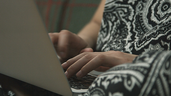 Girl Typing on Laptop