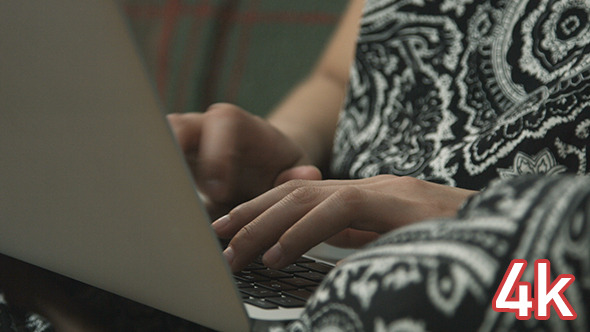 Girl Typing on Laptop