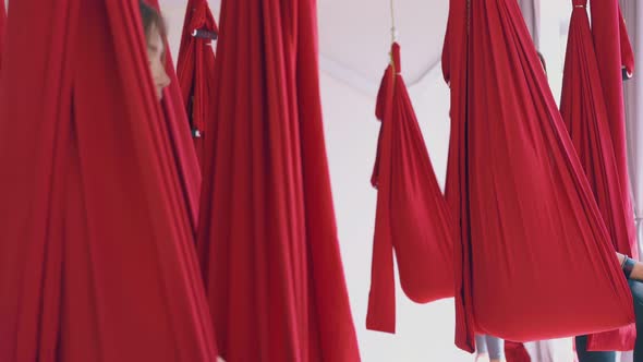 Barefoot Ladies Sit in Hammocks with Closed Eyes Meditating alt