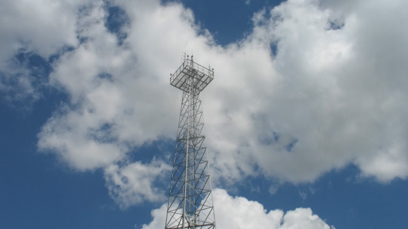 Communication Tower With Sky And Clouds