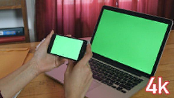 Girl Holding Phone with Laptop Green Screen