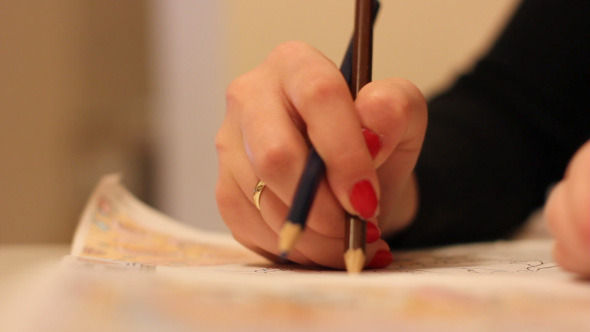 Girl Drawing Picture With Pencil