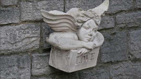 An Angel Sculpture on the Wall of a Church