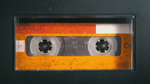 Audio Tape. Vintage Tape Recorder Plays Audio Cassette Inserted Therein alt