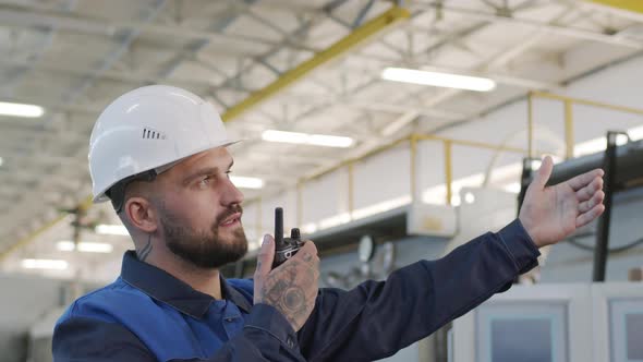  Plant Supervisor Giving Instructions on Walkie-Talkie alt